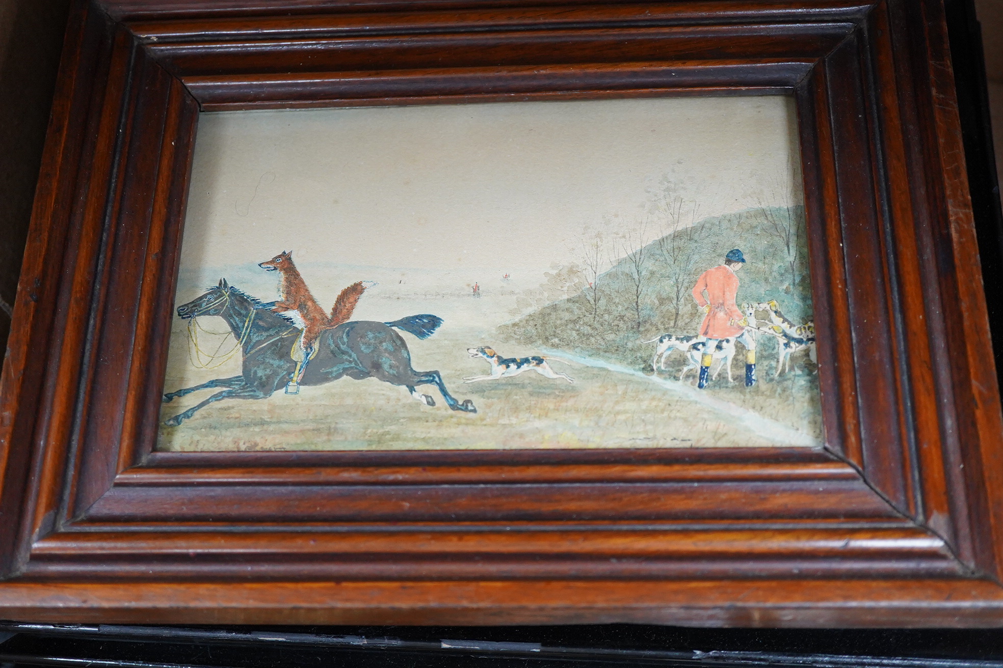 A collection of watercolour and printed miniatures and frames to include: 19th century and later oval silhouette portraits, one rosewood framed, various ebonised and partially gilt frames and a comical watercolour, hunti